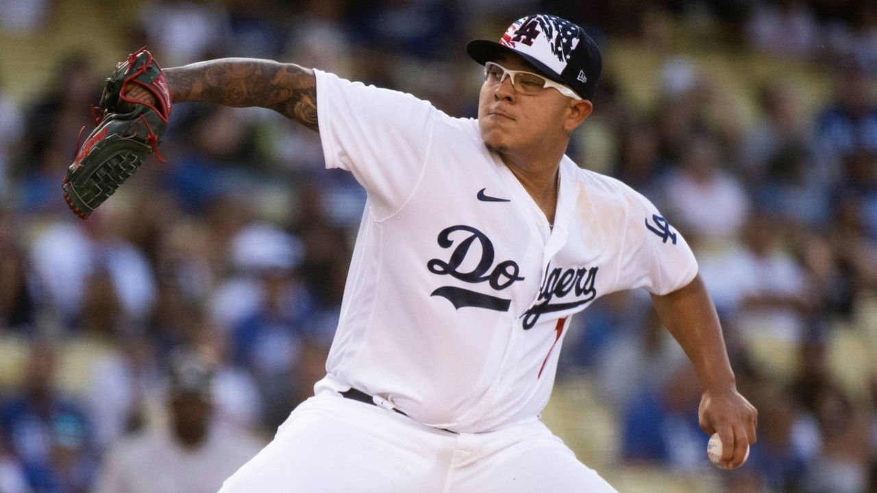 Los Angeles Dodgers starting pitcher Julio Urias throws during the first inning of a baseball game against the Colorado Rockies in LA on Monday. (AP Photo/Kyusung Gong)