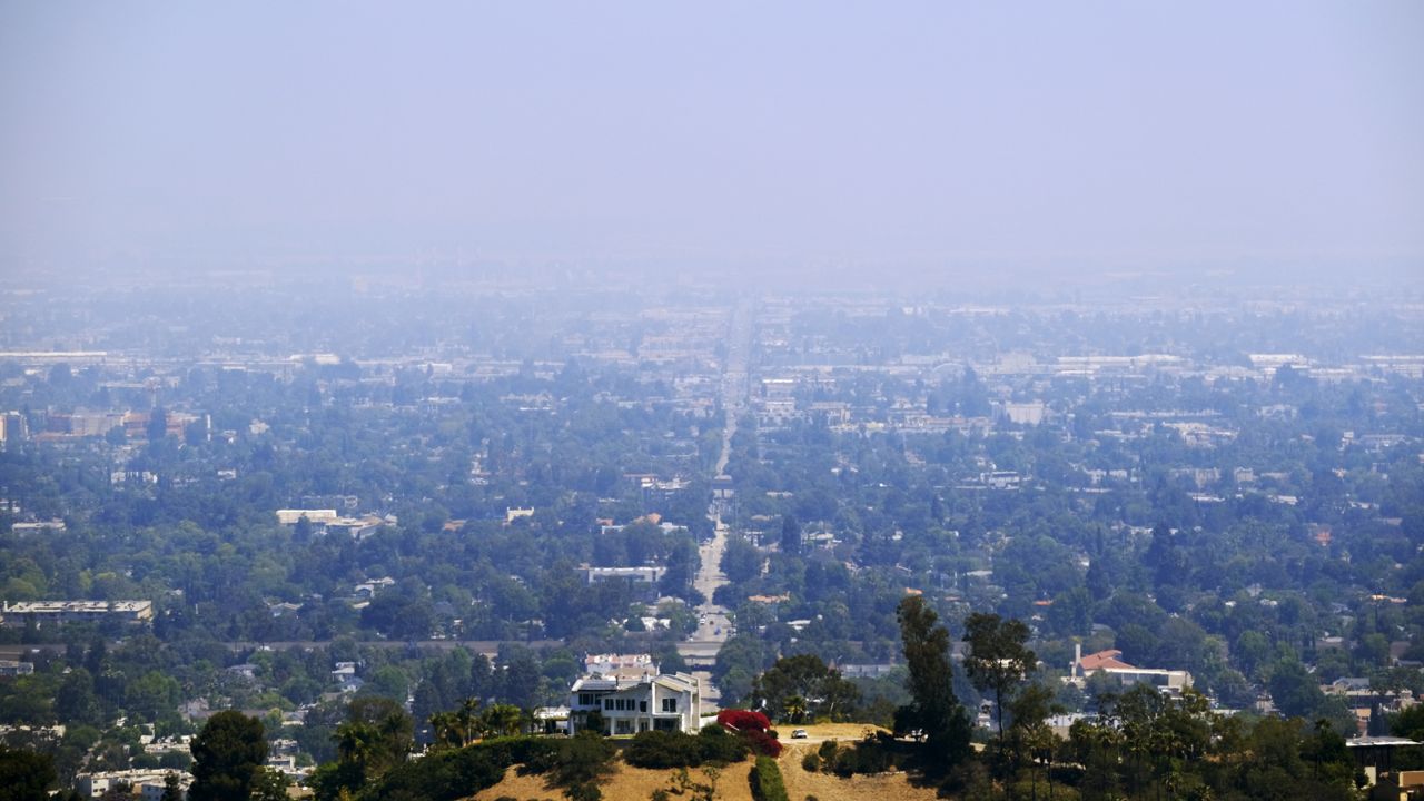 A thick haze is seen over the San Fernando Valley section of Los Angeles on Monday, July 5, 2021. (AP Photo/Richard Vogel)