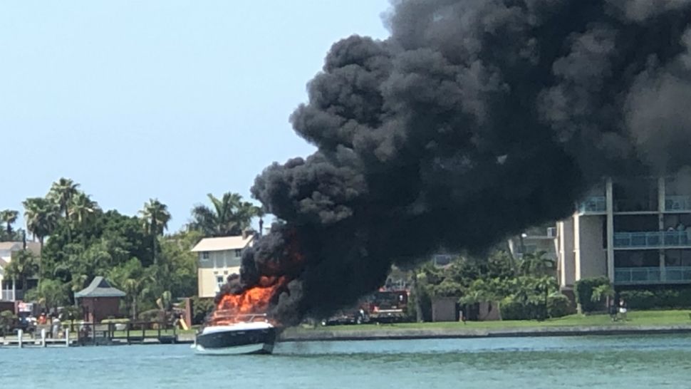 The boat was being fueled at a dock when it exploded. The two people on the boat jumped into the water and were pulled to safety. (Viewer photo)