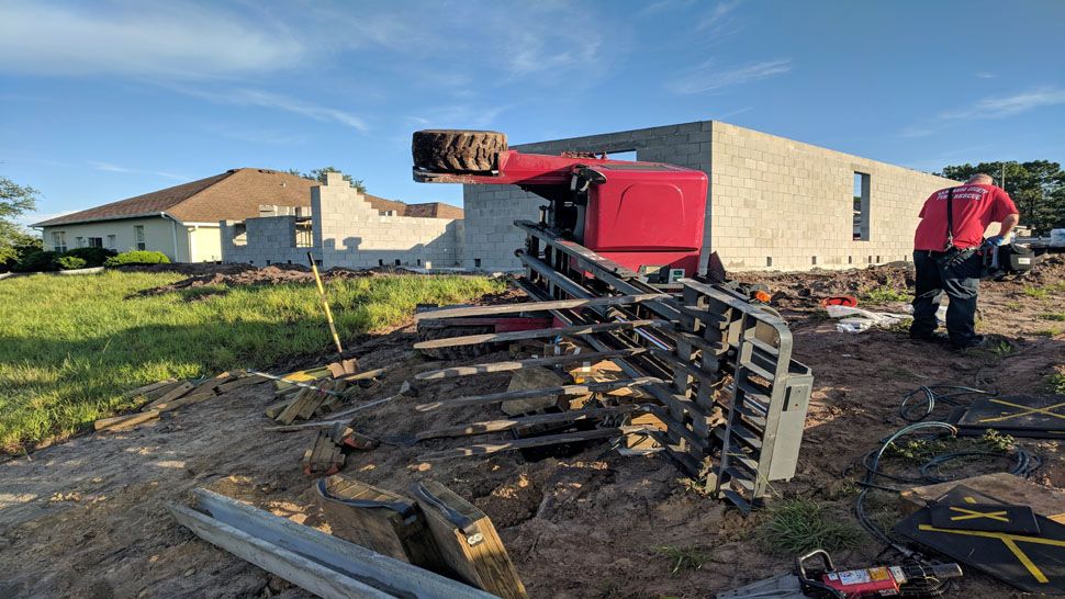 A forklift operator was moving a large section of concrete Thursday morning when the ground gave way, and the forklift fell onto its side, firefighters said. (Hernando County Fire Rescue)
