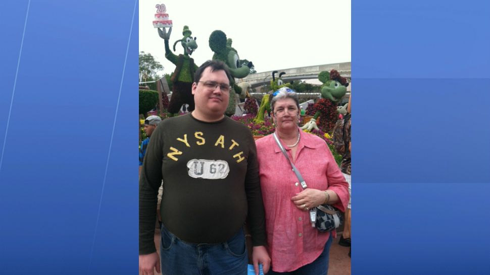 Robert Henry and his mom, Sylvia, visit Epcot in this undated photo provided by the family. Sylvia Henry said she had no idea her son was in such a dark place before he took his own life at Orlando International Airport in February. (Courtesy of Henry family)