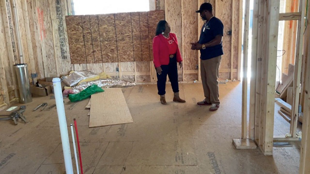 Chris Pugh talks with the first women to complete his course inspiring women to become general contractors.