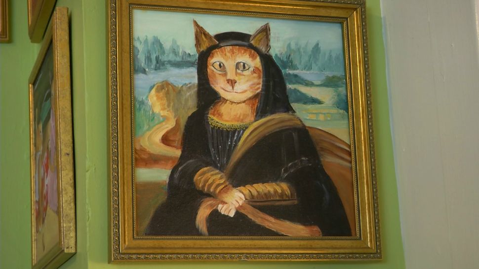 Helen Crawford is a pet lover. You can tell by just walking into her home as her walls are filled with frames of cats that were hand painted by her (Stephanie Becahara, staff).