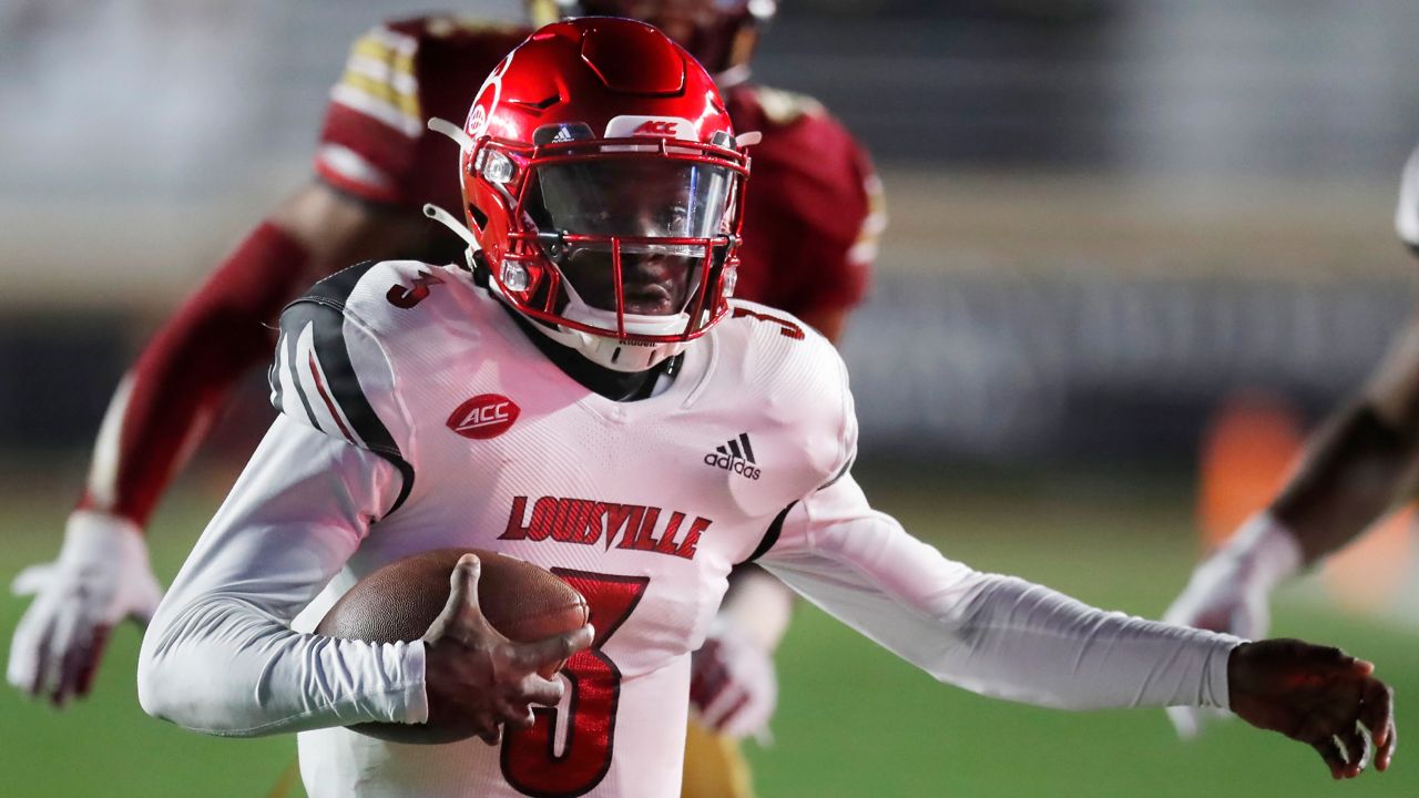 Louisville quarterback Malik Cunningham (3) carries the ball during the first half of an NCAA college football game against Boston College, Saturday, Nov. 28, 2020, in Boston. (AP Photo/Michael Dwyer)