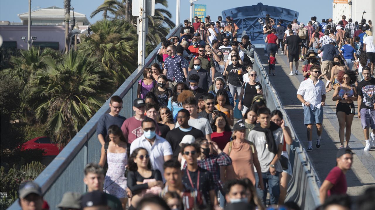Crowd gather on the pier to celebrate the Independence Day in Santa Monica, Calif., Sunday, July 4, 2021. (AP Photo/Kyusung Gong)