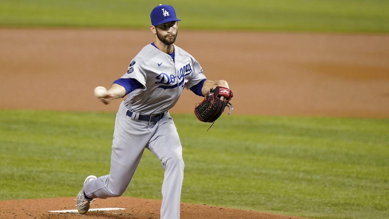 Los Angeles Dodgers' Jake Reed delivers a pitch during the first inning of the team's baseball game against the Miami Marlins, Wednesday, July 7, 2021, in Miami. (AP Photo/Wilfredo Lee)