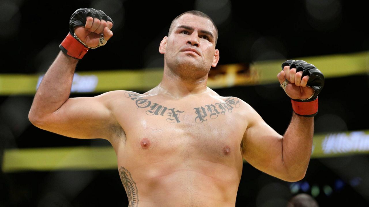 Cain Velasquez celebrates after defeating Travis Browne in their heavyweight mixed martial arts bout at UFC 200, July 9, 2016, in Las Vegas. (AP Photo/John Locher)