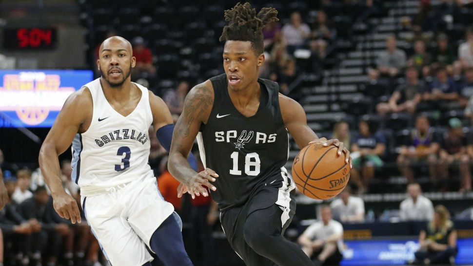 San Antonio Spurs guard Lonnie Walker IV (18) drives as Memphis Grizzlies guard Jevon Carter (3) trails during the first half of an NBA summer league basketball game Thursday, July 5, 2018, in Salt Lake City. (AP Photo/Rick Bowmer)