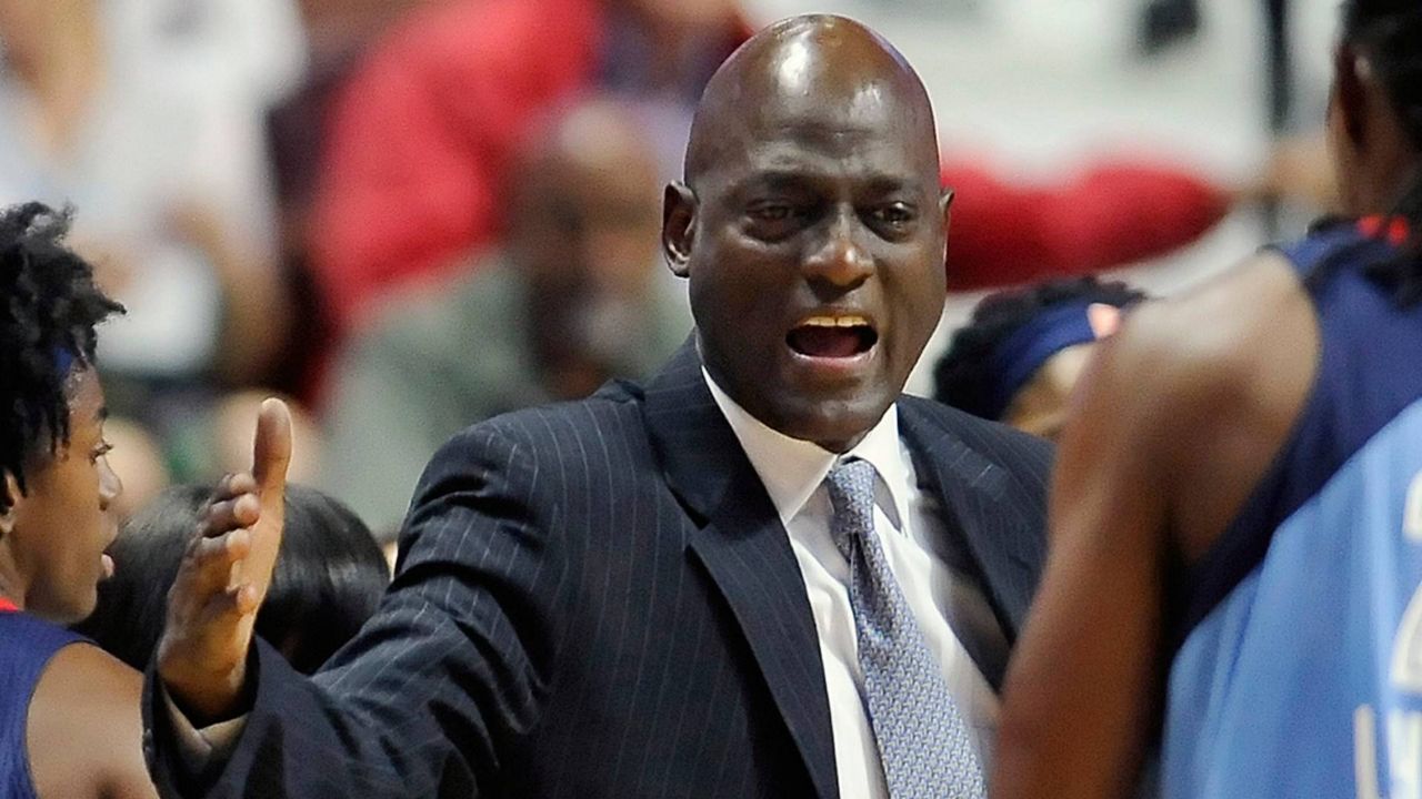 In this July 10, 2016, file photo, Atlanta Dream head coach Michael Cooper talks to players during a timeout in the second half of a WNBA game against the Connecticut Sun, in Uncasville, Conn. (AP Photo/Jessica Hill)