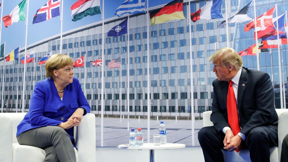 President Trump speaks with German Chancellor Angela Merkel during the NATO Summit last week. (File/AP)