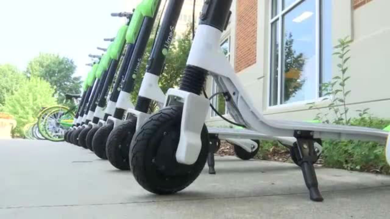 Commercial motorized scooters on a street (Spectrum News/File)