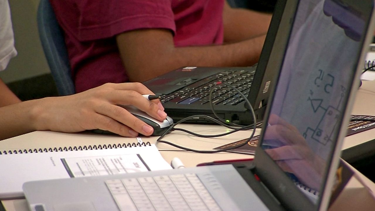 For college students, dreams of being in the so-called 'real world' are being overshadowed by the high interest on student loans. (Spectrum News image)