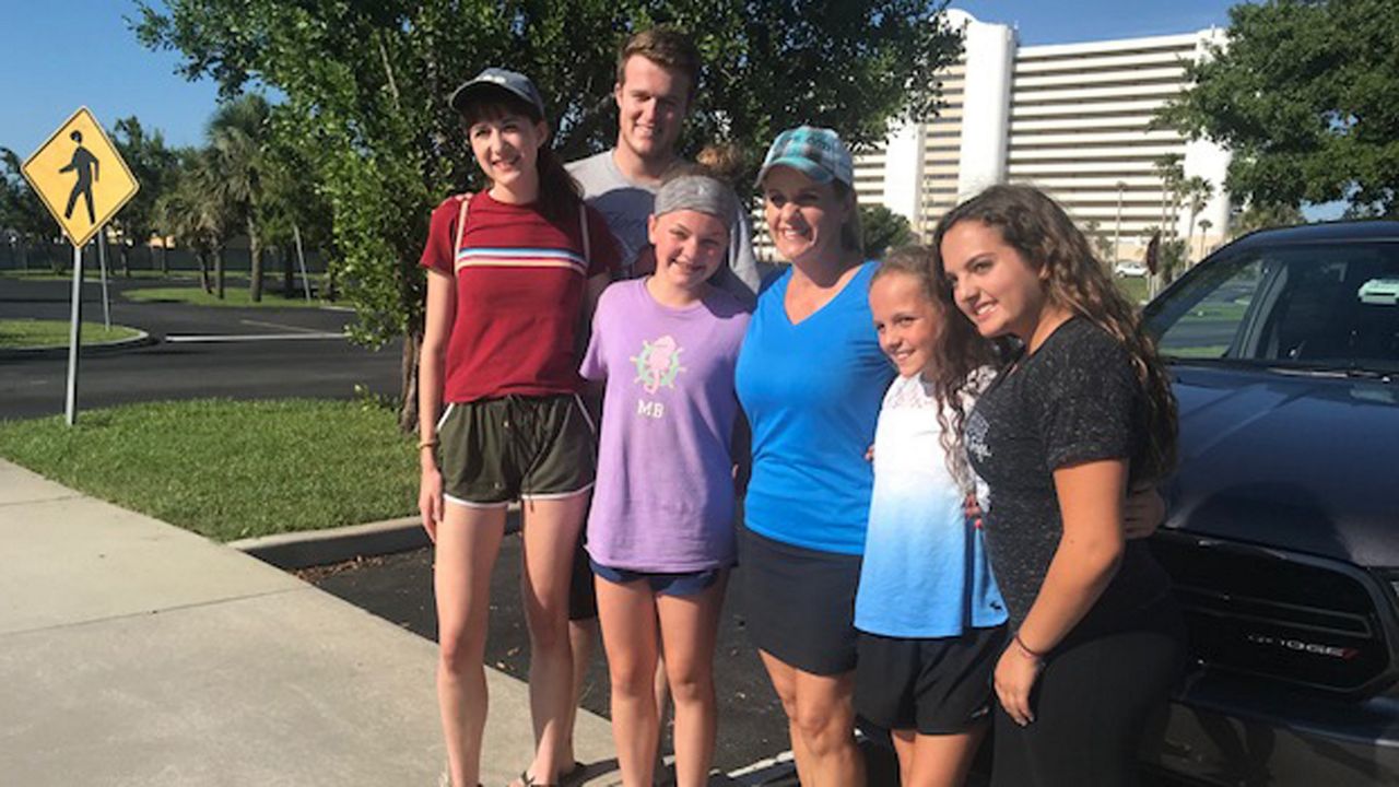 Half of a Brevard County church group returned home safely after being stranded in Haiti as rioting broke out in that country's capitol city. (Greg Pallone, staff)