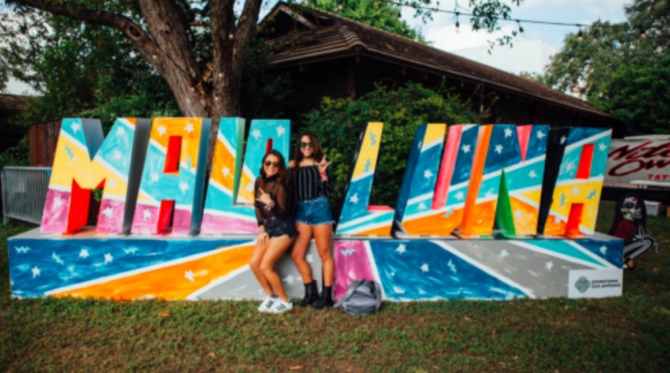 An image of two people posing for a photo in front of a Mala Luna sign during the two-day festival (Courtesy: Mala Luna Festival/File)