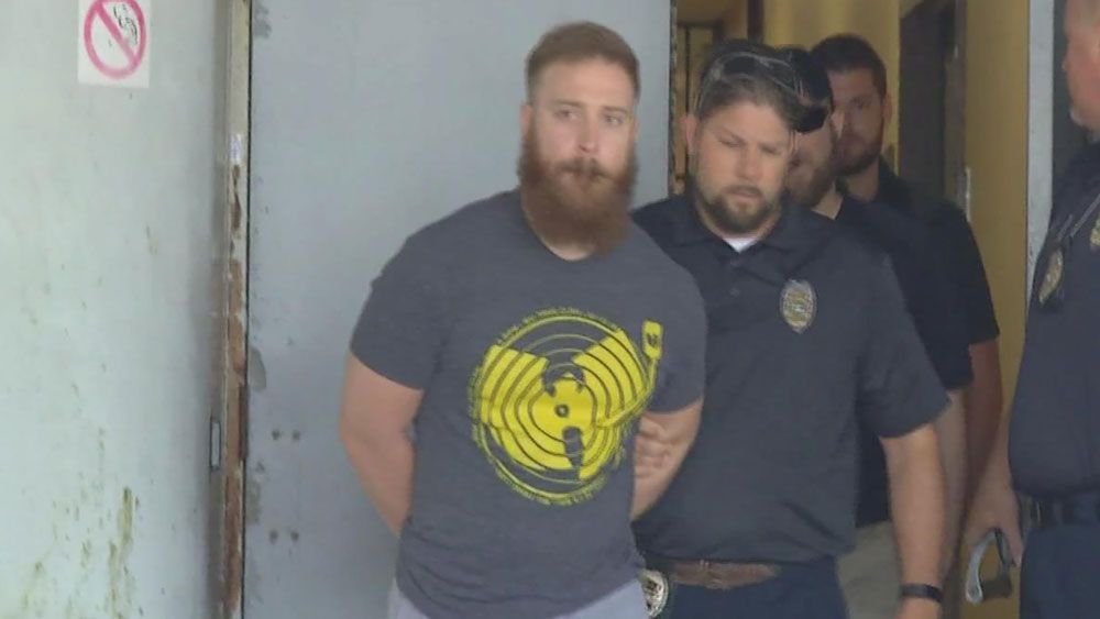 Kyle Hnatkiewicz was taken to jail Friday in Brevard County, accused of video voyeurism at three different stores. (Spectrum News 13)