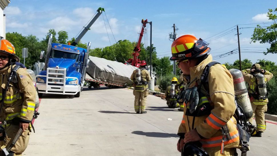 Tractor-trailer overturns on Slaughter Lane. (Courtesy: @AustinFireInfo)