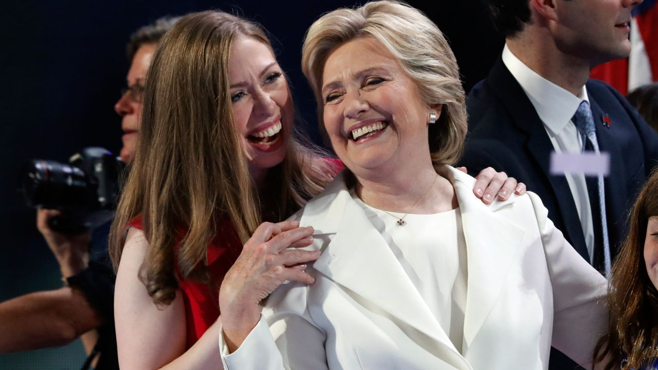 Democratic presidential candidate Hillary Clinton shares a moment on stage with daughter Chelsea at the Democratic National Convention in Philadelphia, Thursday, July 28, 2016. (AP Photo/Paul Sancya)