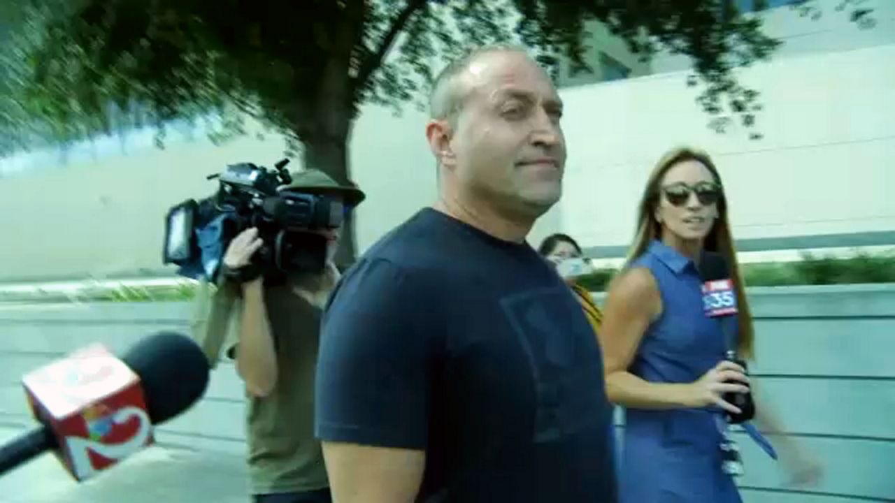 Kevin Tuck walks out of federal court in Orlando on Thursday after his arrest on charges related to the U.S. Capitol attack. (Spectrum News/Autumn Herder Calica)