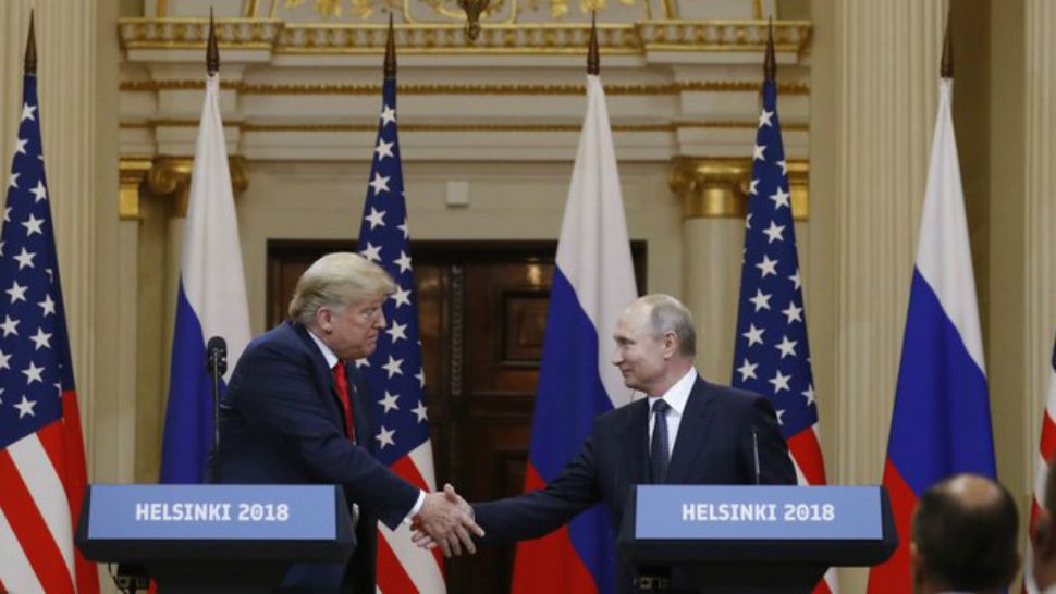 President Donald Trump, left, shakes hand with Russian President Vladimir Putin during a press conference after their meeting at the Presidential Palace in Helsinki, Finland, Monday, July 16, 2018. (AP Photo/Alexander Zemlianichenko)