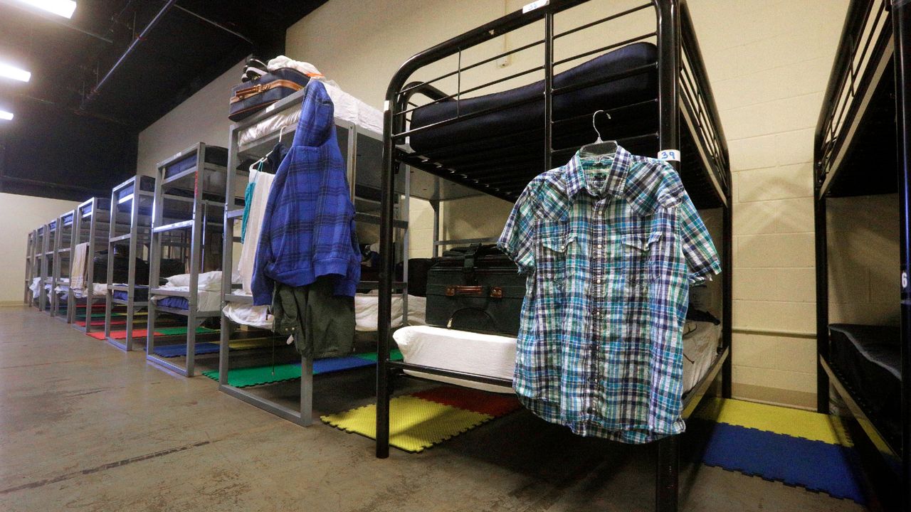 Some homeless shelters in the U.S. started charging for services two decades ago, but most appear today to maintain a free-of-charge safety net. (AP Photo/Seth Perlman)
