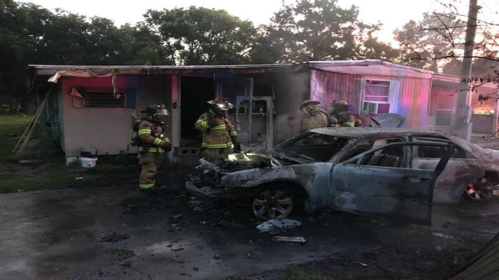 A morning vehicle fire was extinguished rapidly, but not before its heat affected a portion of the mobile home it was parked next to (Ocala Fire Rescue).