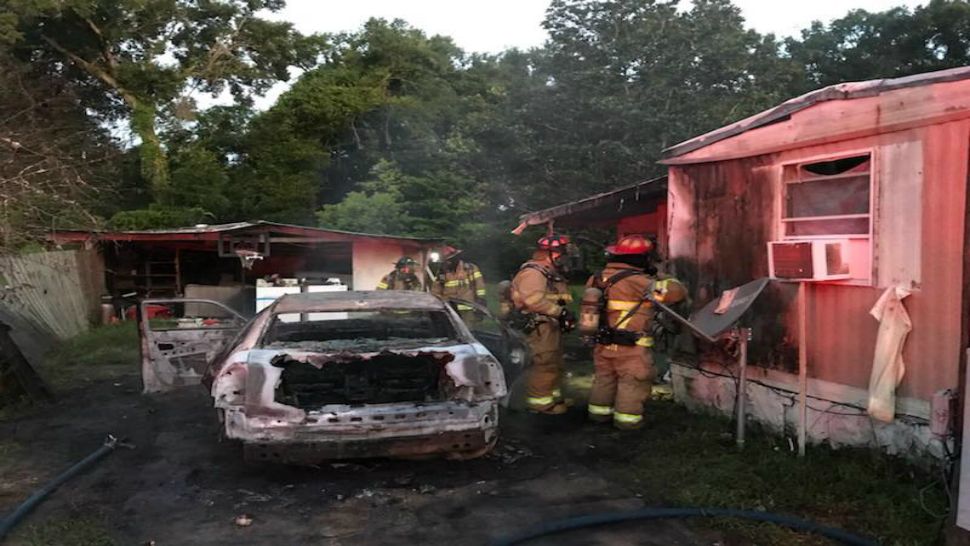 A morning vehicle fire was extinguished rapidly, but not before its heat affected a portion of the mobile home it was parked next to (Ocala Fire Rescue).