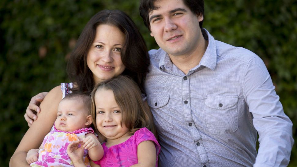 FILE - In this 2014 file photo, concert pianist Vadym Kholodenko, poses with his wife Sofya Tsygankova and daughters, Nika, center, and Michela, at their home in Fort Worth, Texas. On Monday, July 16, 2018, a judge found Tsygankova, Kholodenko's estranged wife, not guilty by reason of insanity in the 2016 deaths of the couple's two daughters. Tsygankova, who was charged with capital murder, was then ordered committed to a state mental hospital. The defense and prosecutors agreed with the ruling. (Joyce Marshall/Star-Telegram via AP, File)