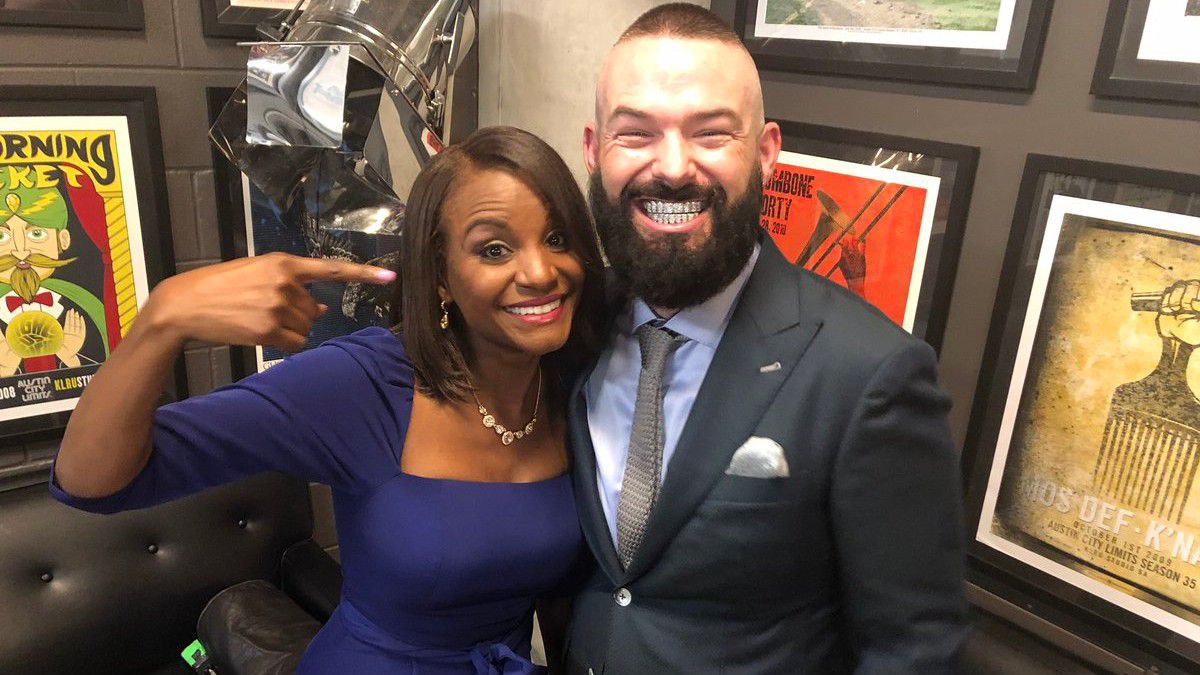 In Focus host Nicole Cross poses with Grammy-nominated rapper Paul Wall (Spectrum News)