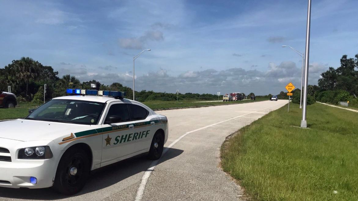 Brevard deputies on the scene of I-95 at the Pineda Causeway exit, where a man reportedly set himself on fire in what they're calling an apparent suicide. (Greg Pallone, staff)