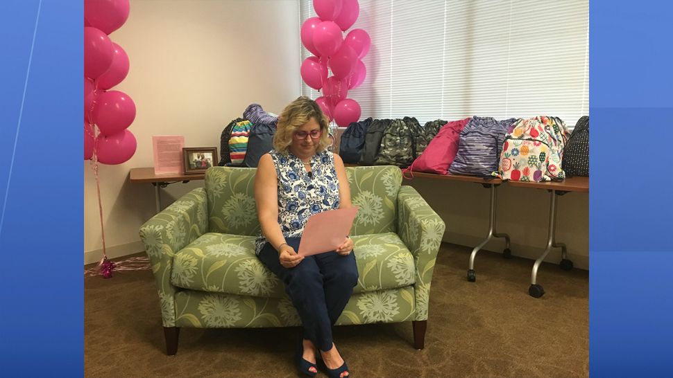 Breast cancer survivor Anne Coletti found her purpose in helping new cancer patients as they begin treatment by creating 'Survivor Sacks.' (Melissa Eichman, staff)