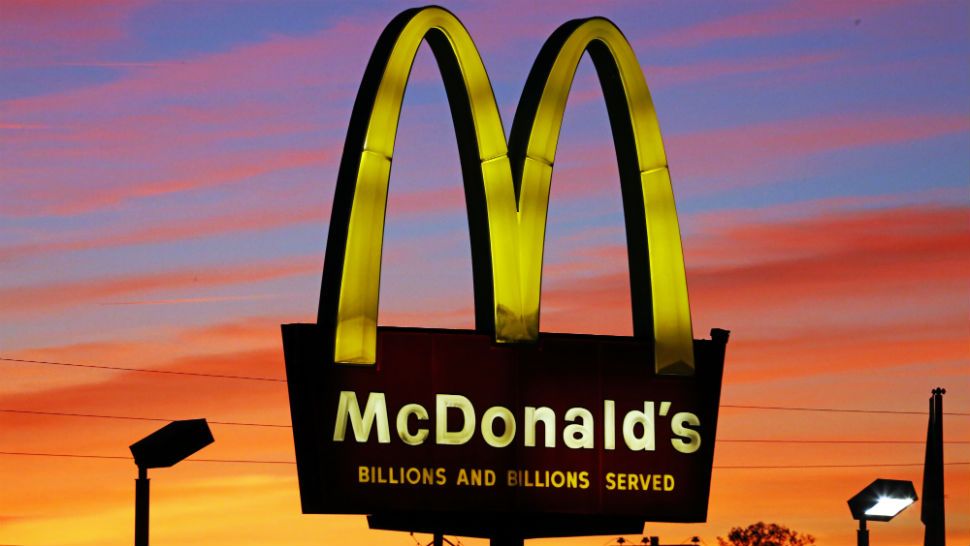 In this Saturday, Oct. 10, 2015, photo, the sun sets behind a McDonald's in Ebensburg, Pa. McDonald's hopes it has a catchy, new deal that will be as hugely popular as its Dollar Menu. Starting Jan. 4, 2016, the fast-food chain will launch the "McPick 2" menu, which will let customers pick two of the following items for $2: a McDouble, a McChicken, small fries and mozzarella sticks. (AP Photo/Gene J. Puskar)