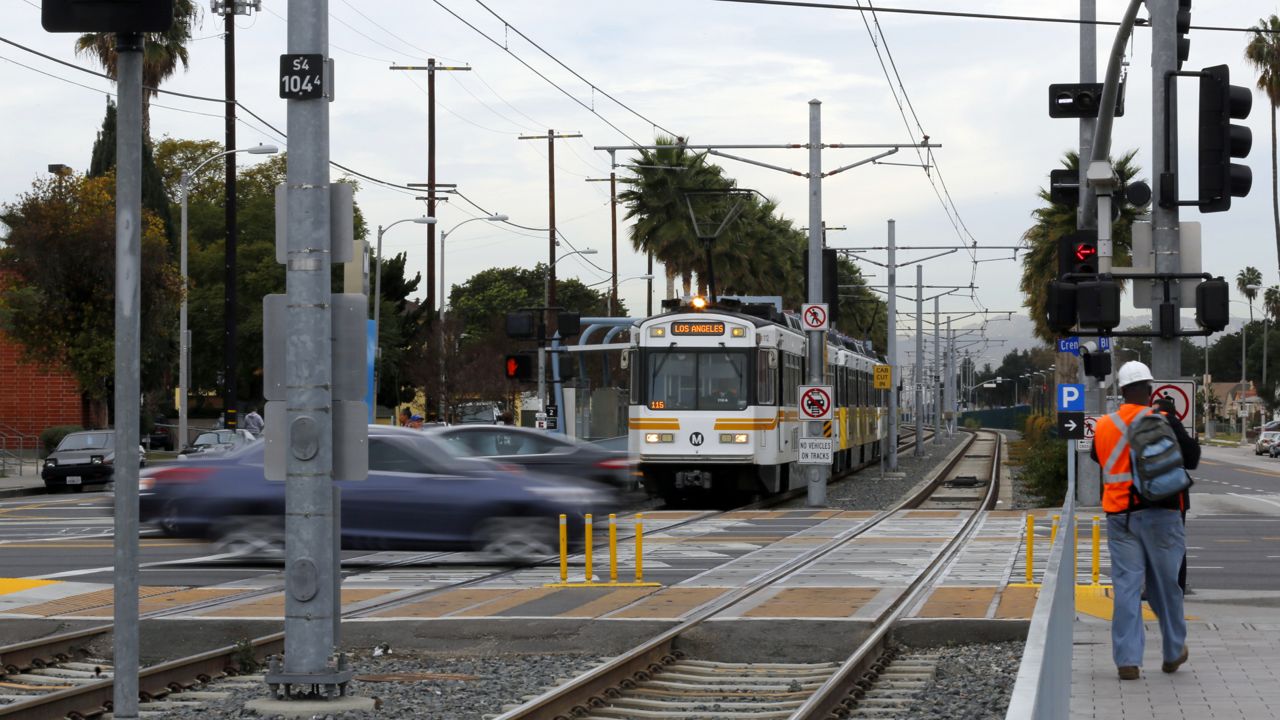 An MTA Expo Line train at the Expo/Crenshaw station, at Exposition and Crenshaw Booulevards, in Los Angeles' Crenshaw district Tuesday, Jan. 21, 2014. (AP Photo/Reed Saxon)