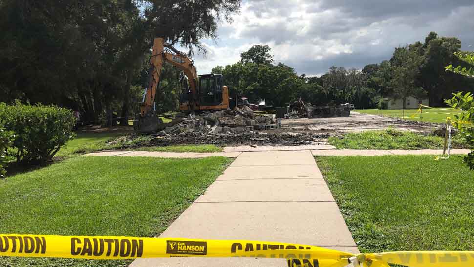 Construction machinery on site where New Testament Church's Fellowship Hall previously stood. The hall was destroyed by a fire last April. (Laurie Davison/Spectrum Bay News 9)