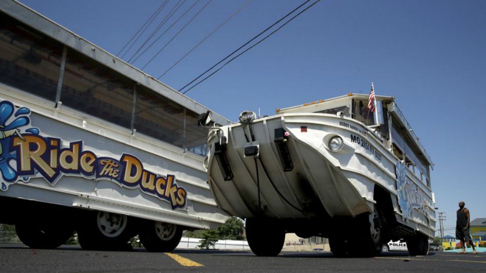 A man looks at an idled duck boat in the parking lot of Ride the Ducks Saturday, July 21, 2018 in Branson, Mo. One of the company’s duck boats capsized Thursday night resulting in several deaths on Table Rock Lake. (AP Photo/Charlie Riedel)