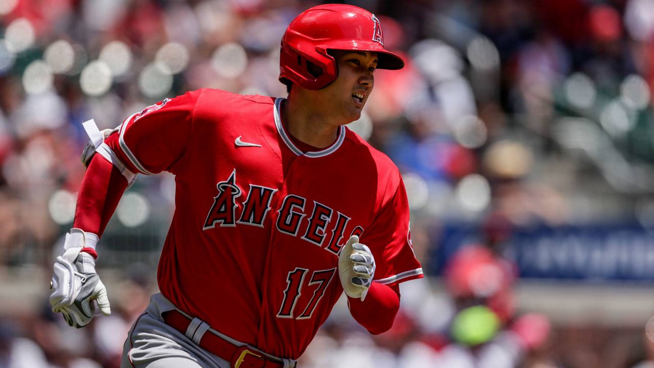 Los Angeles Angels' Shohei Ohtani runs toward first as he flies out during the first inning of a baseball game against the Atlanta Braves Sunday in Atlanta. (AP Photo/Butch Dill)