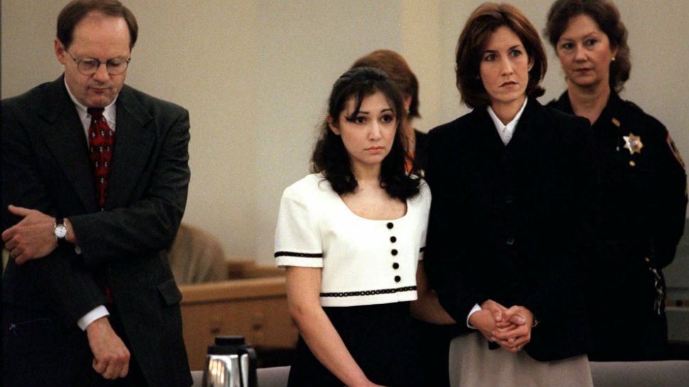 Former Naval Academy midshipman Diane Zamora, center, holds hands with one of her attorneys, Jennifer Morris, as lead attorney Don Gandy, left, listens as District Judge Joe Drago reads the capital murder conviction verdict in Fort Worth, Texas, Tuesday, Feb. 17, 1998. (AP Photo/David Woo)