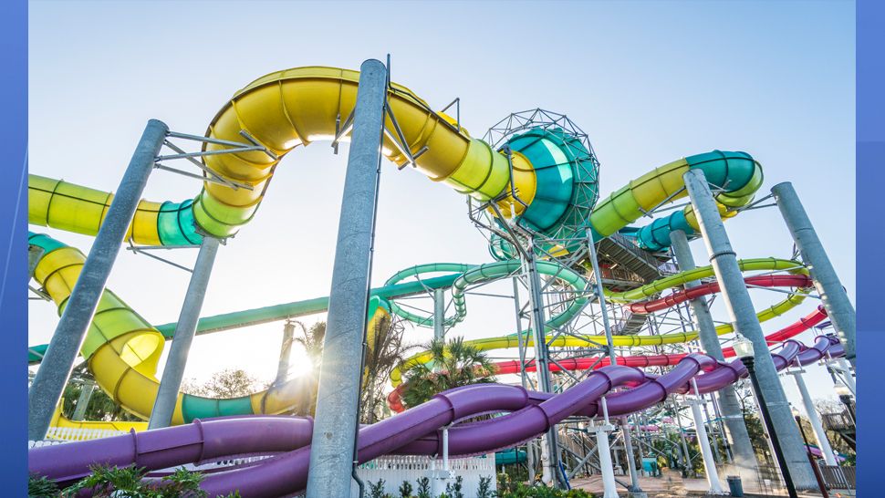 Adventure Island's newest slide, Vanish Point, is a 70-foot drop slide. Riders choose between two wave paths, one that drops the floor from beneath their feet or one that begins in a seated position before taking a steep dive on a 455-foot-long speed slide. (Adventure Island)