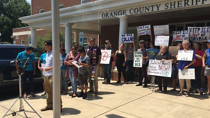 ICE protesters rallied outside the Orange County Sheriff's Office Friday.