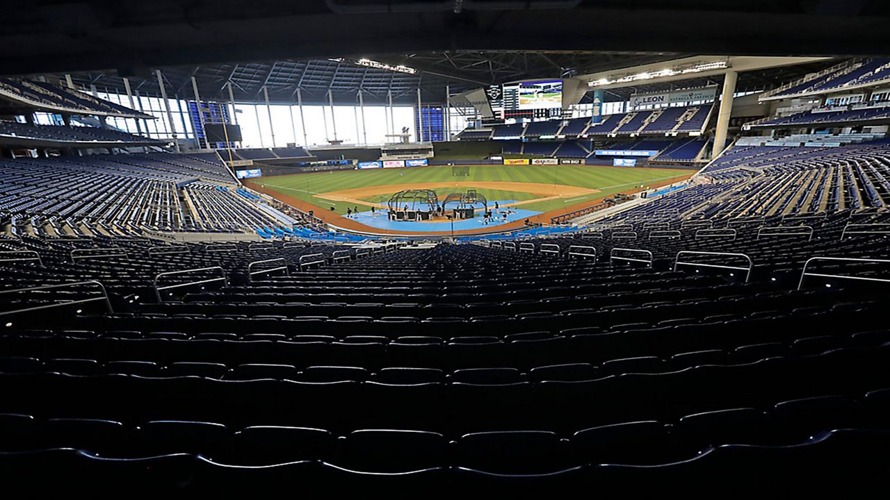 Miami Marlins take batting practice during a baseball workout at Marlins Park, Thursday, July 16, 2020, in Miami. (AP Photo/Wilfredo Lee)