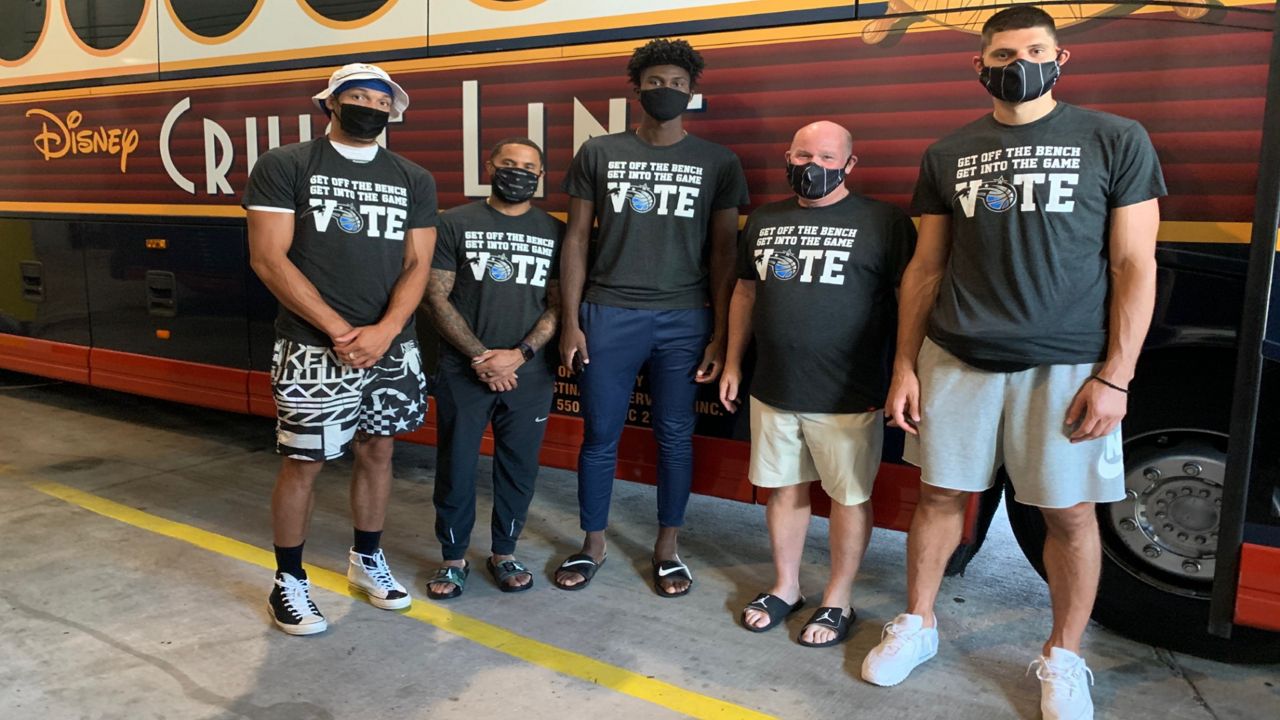 Magic players (from left) Aaron Gordon, D.J. Augustine, coach Steve Clifford, and center Nikola Vucevic wore the Vote shirts when they arrived to the NBA campus for the restart of the season to spread their message of social justice. (Photo Courtesy of Orlando Magic)