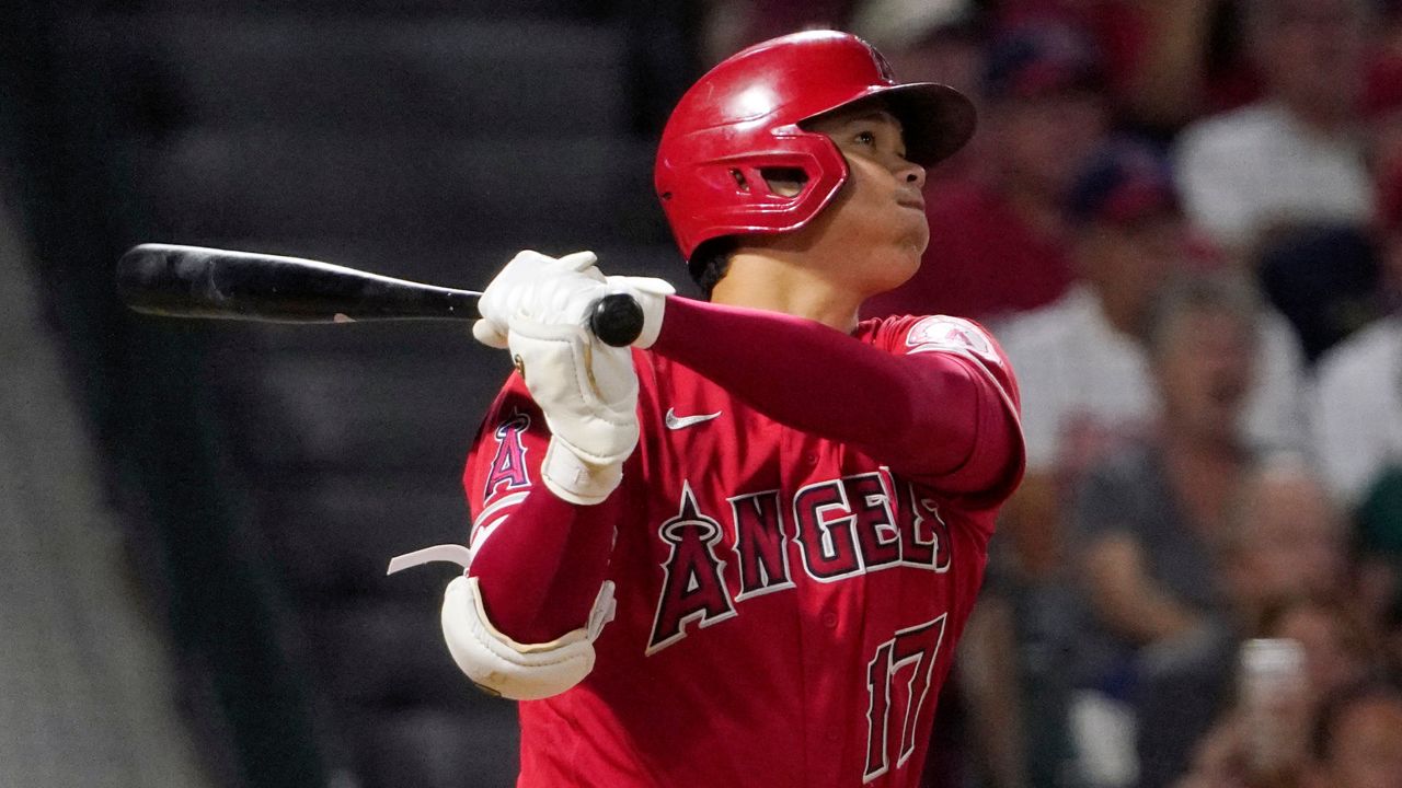 Los Angeles Angels' Shohei Ohtani hits a two-run home run during the sixth inning of a baseball game against the Colorado Rockies Tuesday, July 27, 2021, in Anaheim, Calif. (AP Photo/Mark J. Terrill)