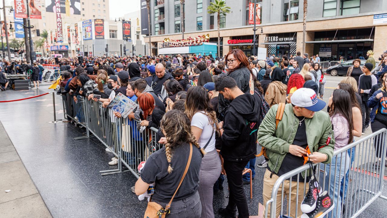 Hundreds of fans of Red Hot Chili Peppers cut Hollywood Boulevard during a ceremony honoring the band with a star on the Hollywood Walk of Fame on Thursday, March 31, 2022, in Los Angeles. (Photo by Willy Sanjuan/Invision/AP)
