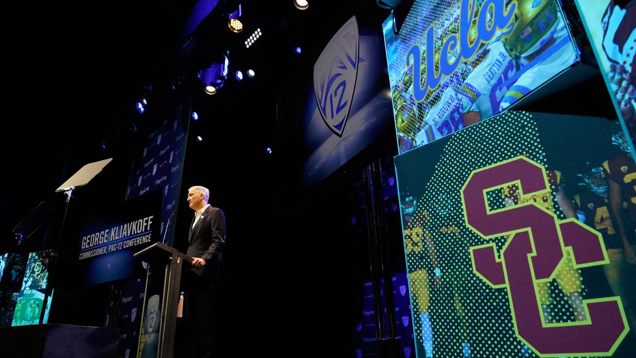 Pac-12 Conference commissioner George Kliavkoff speaks at the Pac-12 NCAA college football media day Friday, July 29, 2022, in Los Angeles. (AP Photo/Damian Dovarganes)