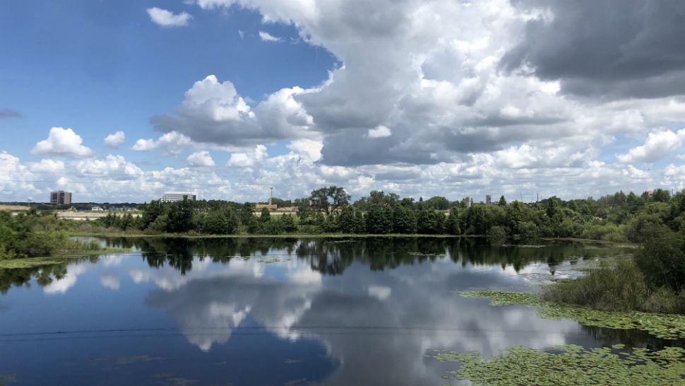 Sent to us via the Spectrum News 13 app: Clouds build over Big Sand Lake in the Dr. Phillips area of Orange County on Monday afternoon. (Karen Lary, viewer)