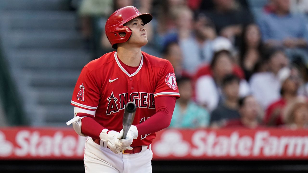 Los Angeles Angels' Shohei Ohtani, of Japan, watches the fight of his three-run home run during the third inning of a baseball game against the Texas Rangers Saturday, July 30, 2022, in Anaheim, Calif. (AP Photo/Jae C. Hong)