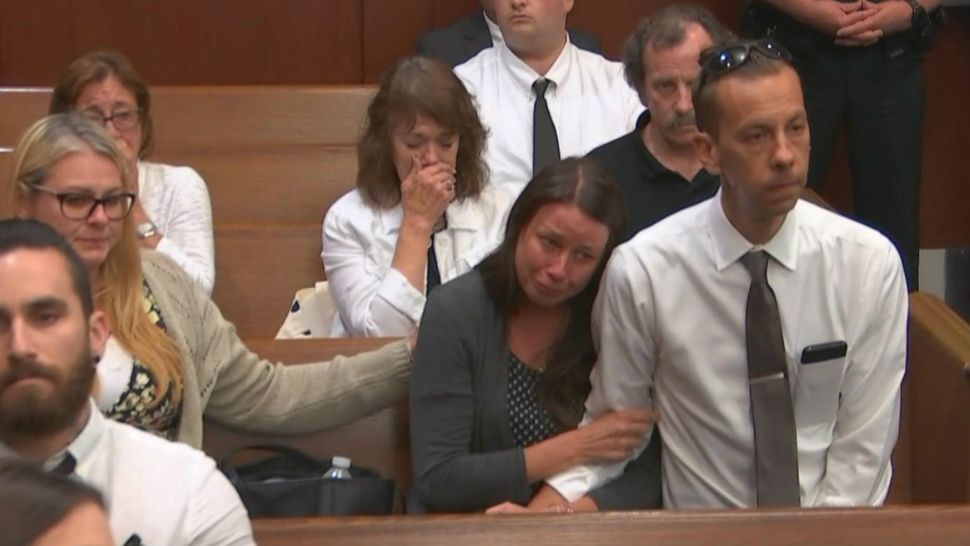 Family members and loved ones of Chad and Margaret Amato weep as the couple's son, Grant Amato, is found guilty Wednesday night of 3 counts of 1st-degree premeditated murder in their deaths and the death of his brother, Cody, in January. (Spectrum News 13)