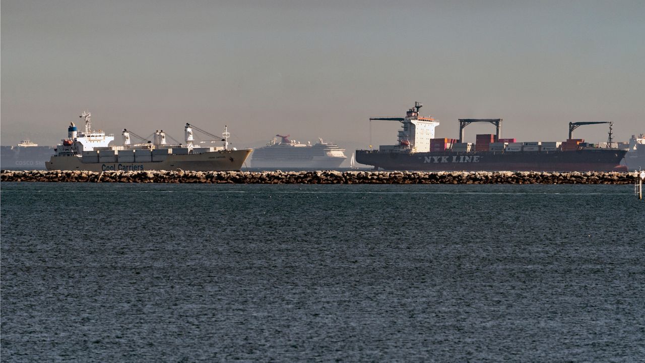 temoIn this Feb. 19, 2021 photo, high number of container ships, a cruise ship, and a small sail boat, dot the coast of Long Beach waiting to dock at the Ports of Los Angeles and Long Beach off the California Coast. (AP Photo/Damian Dovarganes)