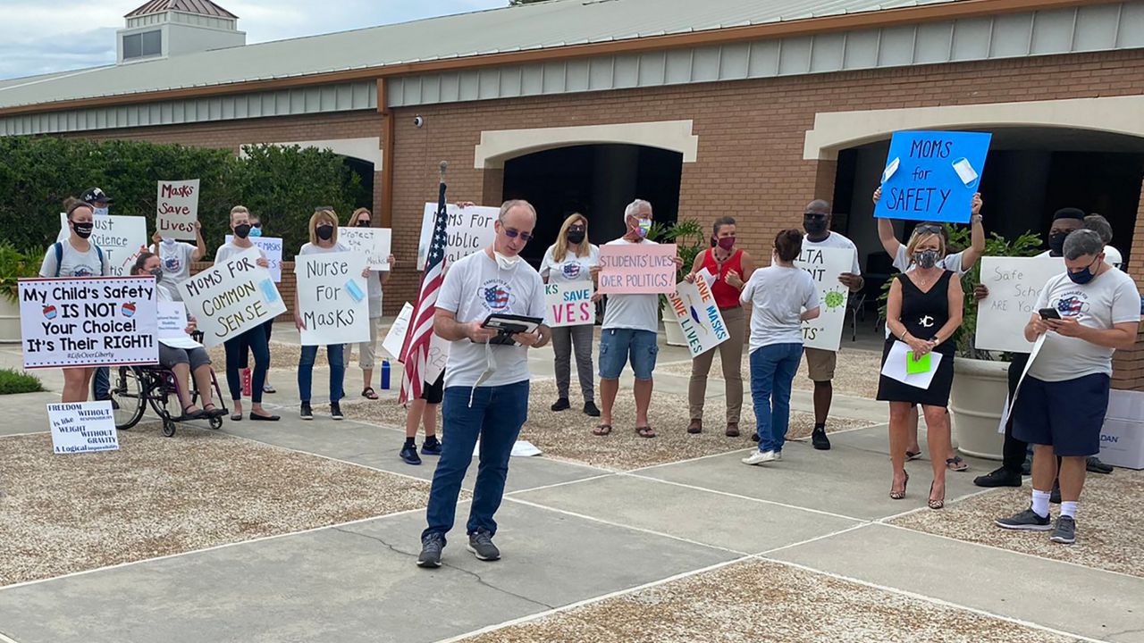 Parents both for and against a mask mandate came out to voice their opinion during a Brevard County school district meeting on Tuesday evening, Aug. 10, 2021.(Spectrum News 13/Julie Gargotta)