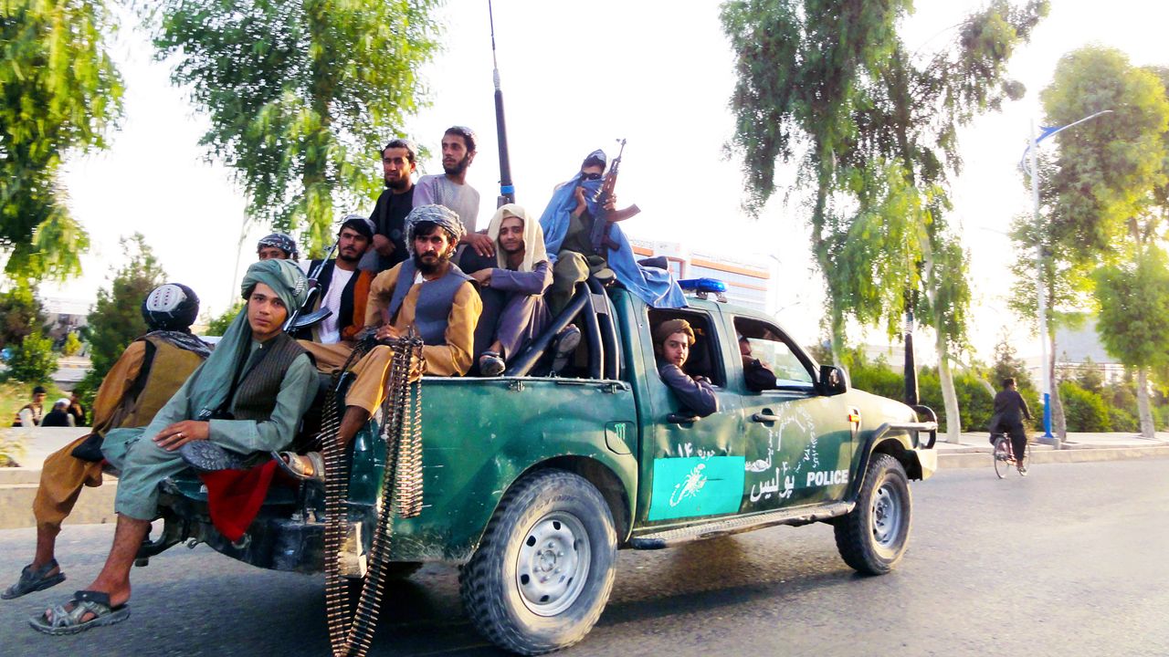 Taliban fighters patrol inside the city of Kandahar, southwest Afghanistan, Sunday, Aug. 15, 2021. (AP Photo/Sidiqullah Khan)