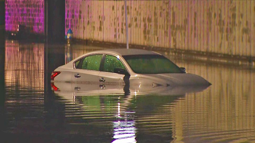 The water rose pretty high that nearly reached the side-view mirror of this silver car. (Spectrum News 13)
